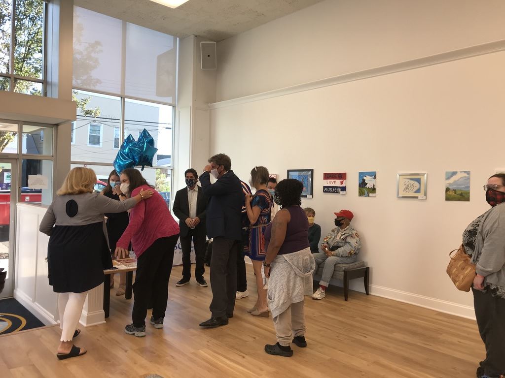 Group of people at Shore House booth.