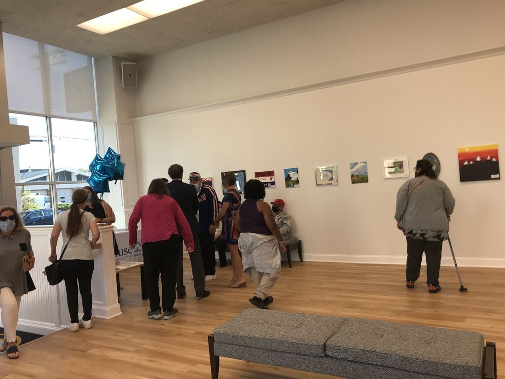 People in corner by booth