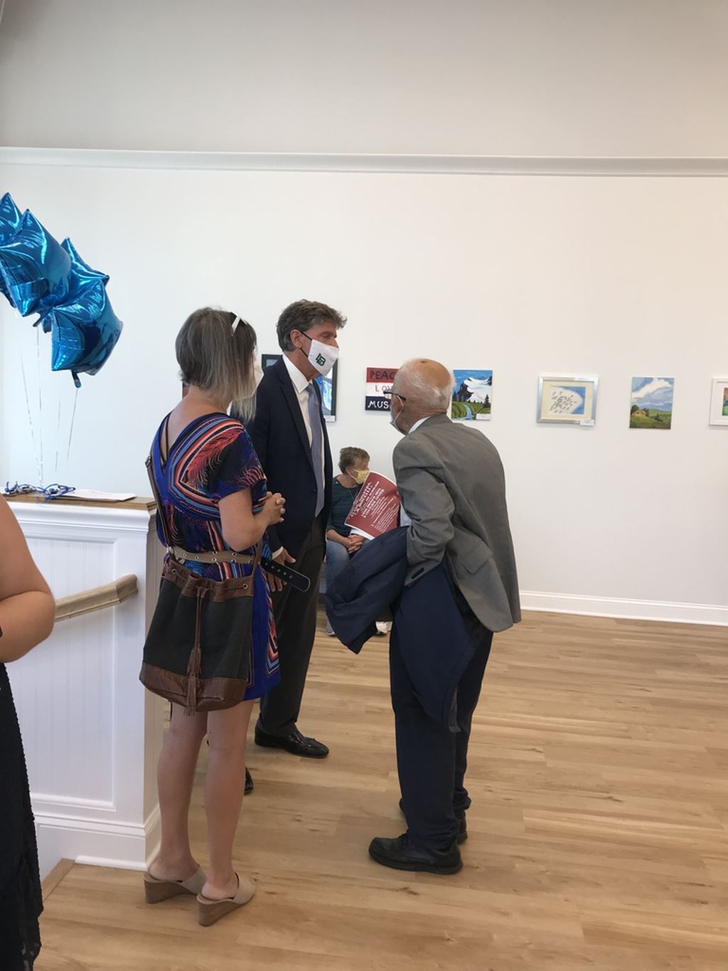 Three people talking with eachother