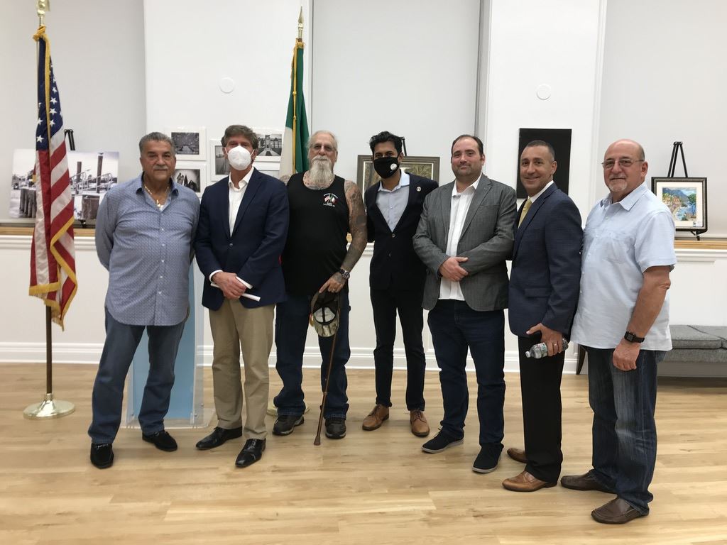 Seven men standing for photo