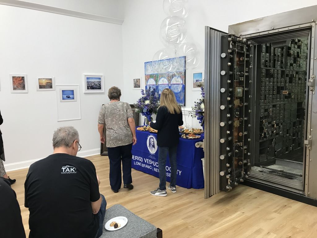 People standing by table with snacks