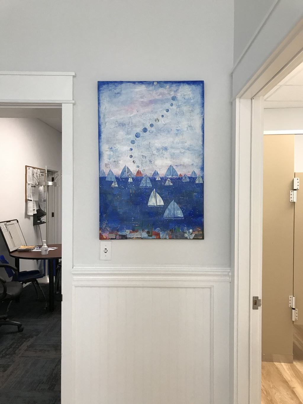 Painting of ocean with sailboats