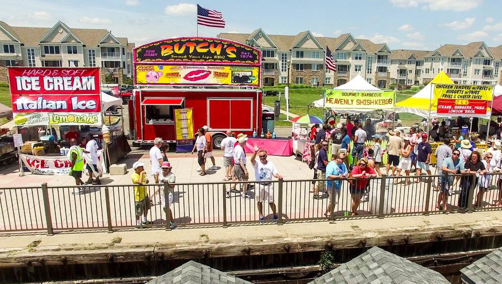 Food stands on boardwalk.