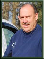 Man in blue sweatshirt.